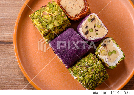 Turkish delight or lokum is a traditional Eastern sweet made with nuts. Turkish delight, lokum Turkish delight or lokum is a traditional Eastern sweet made with nuts. Turkish delight, lokum 141491582
