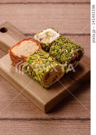 Turkish delight or lokum is a traditional Eastern sweet made with nuts. Turkish delight, lokum Turkish delight or lokum is a traditional Eastern sweet made with nuts. Turkish delight, lokum 141491596
