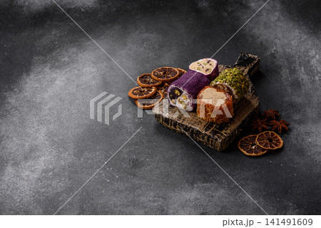 Turkish delight or lokum is a traditional Eastern sweet made with nuts. Turkish delight, lokum Turkish delight or lokum is a traditional Eastern sweet made with nuts. Turkish delight, lokum 141491609