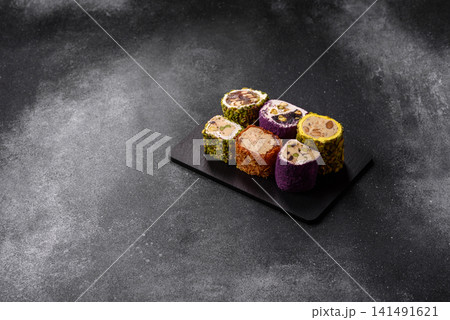 Turkish delight or lokum is a traditional Eastern sweet made with nuts. Turkish delight, lokum Turkish delight or lokum is a traditional Eastern sweet made with nuts. Turkish delight, lokum 141491621