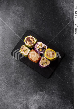 Turkish delight or lokum is a traditional Eastern sweet made with nuts. Turkish delight, lokum Turkish delight or lokum is a traditional Eastern sweet made with nuts. Turkish delight, lokum 141491622