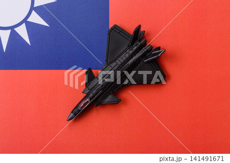 A fighter jet against the taiwanese flag as a conceptual background representing defense 141491671