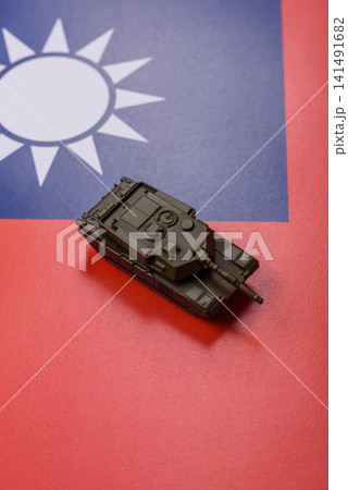 A tank on the taiwanese flag as a conceptual backdrop representing defense A tank on the taiwanese flag as a conceptual backdrop representing defense 141491682
