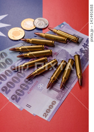 Assault rifle cartridges on the taiwanese flag, serving as a conceptual background for defense 141491688