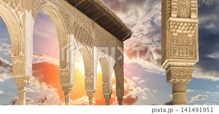 Arches in Islamic (Moorish) style (against the sunset) in Alhambra, Granada, Spain Arches in Islamic (Moorish) style (against the sunset) in Alhambra, Granada, Spain 141491951