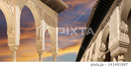 Arches in Islamic (Moorish) style (against the sunset) in Alhambra, Granada, Spain 141491997