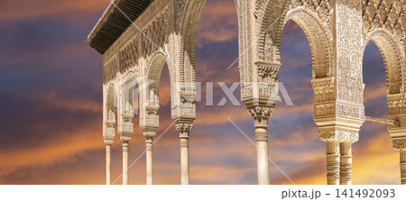Arches in Islamic (Moorish) style (against the sunset) in Alhambra, Granada, Spain 141492093