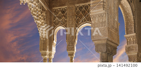 Arches in Islamic (Moorish) style (against the sunset) in Alhambra, Granada, Spain Arches in Islamic (Moorish) style (against the sunset) in Alhambra, Granada, Spain 141492100