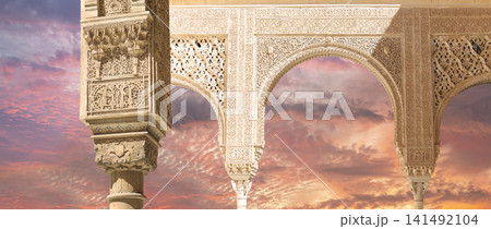 Arches in Islamic (Moorish) style (against the sunset) in Alhambra, Granada, Spain 141492104