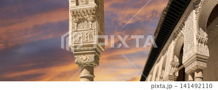 Arches in Islamic (Moorish) style (against the sunset) in Alhambra, Granada, Spain 141492110