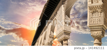 Arches in Islamic (Moorish) style (against the sunset) in Alhambra, Granada, Spain Arches in Islamic (Moorish) style (against the sunset) in Alhambra, Granada, Spain 141492111