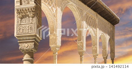 Arches in Islamic (Moorish) style (against the sunset) in Alhambra, Granada, Spain 141492114