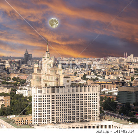 Aerial view of Moscow against the romantic evening sky with clouds and rays of the sun with the super moon. Government House of the Russian Federation (White House)-written in Russian, Russia 141492314