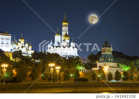 Night view of the Moscow Kremlin, Russia (the most popular view). Against the background of a beautiful sky with the moon Night view of the Moscow Kremlin, Russia (the most popular view). Against the background of a beautiful sky with the moon 141492338