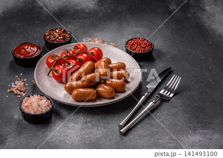 Chicken or pork grilling sausages with garlic, salt, and spices. Grilling sausages Chicken or pork grilling sausages with garlic, salt, and spices. Grilling sausages 141493100