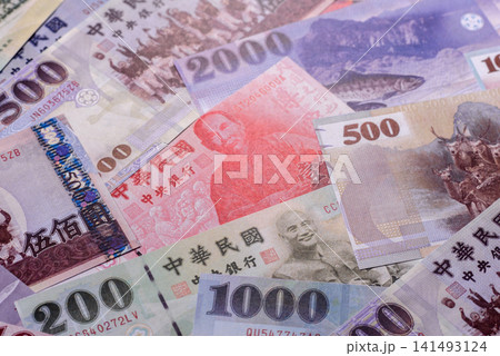 Taiwan, Taiwanese paper banknotes and coins, dollars of various denominations. Taiwanese dollars Taiwan, Taiwanese paper banknotes and coins, dollars of various denominations. Taiwanese dollars 141493124