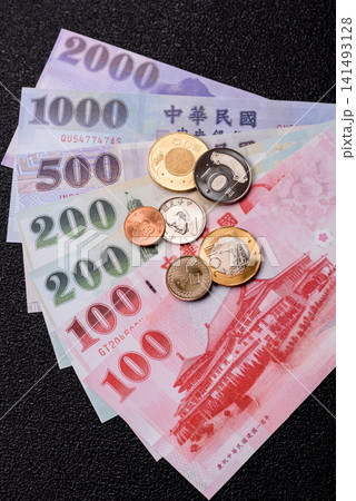 Taiwan, Taiwanese paper banknotes and coins, dollars of various denominations. Taiwanese dollars Taiwan, Taiwanese paper banknotes and coins, dollars of various denominations. Taiwanese dollars 141493128