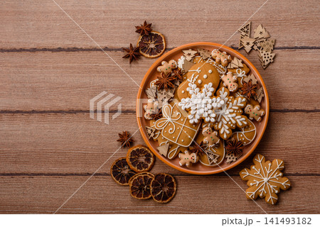 Gingerbread as a Christmas staple, sweet biscuits for the holiday table. Gingerbread as a backdrop Gingerbread as a Christmas staple, sweet biscuits for the holiday table. Gingerbread as a backdrop 141493182