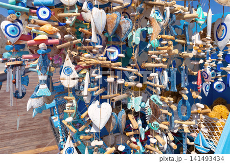 Traditional Greek Souvenirs with Evil Eye Charms at Market Stall in Rhodes, Greece 141493434