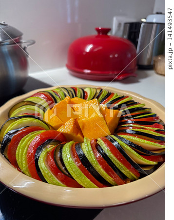Preparing colorful vegetable ratatouille with pumpkin Preparing colorful vegetable ratatouille with pumpkin 141493547