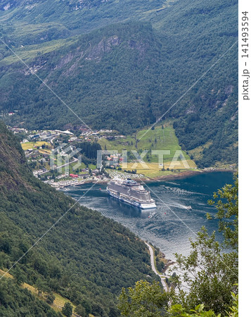 Cruise ship navigating geirangerfjord near geiranger village Cruise ship navigating geirangerfjord near geiranger village 141493594