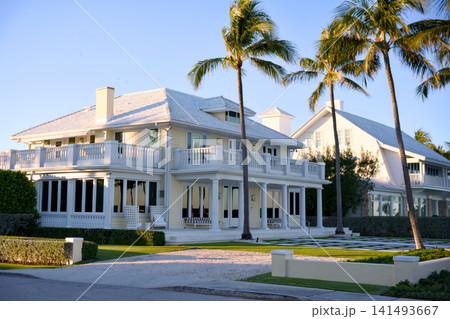 Coastal Style House With Wraparound Porch And Curved Driveway 141493667