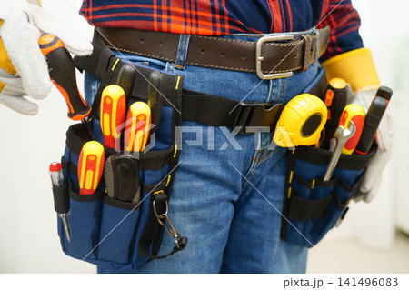 Male builder worker with tool belt pocket at waist. Male builder worker with tool belt pocket at waist. 141496083