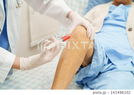 Asian doctor inject Hyaluronic acid platelet rich plasma into knee of senior woman. 141496102