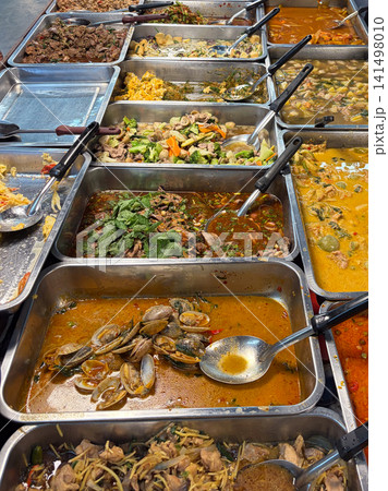 Many menu of Thai food on the stainless trays ready for sale in the morning market in Thailand 141498010