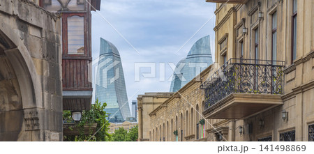 Historic Icherisheher buildings looking towards modern Flame Towers with copy space Historic Icherisheher buildings looking towards modern Flame Towers with copy space 141498869