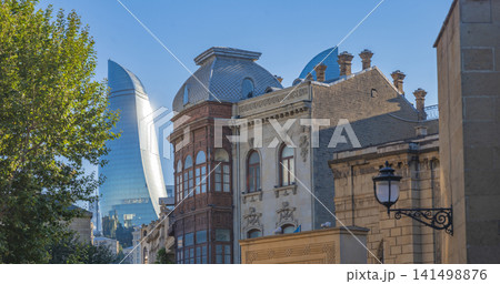 Icherisheher street with street lantern against shining Flame Tower with copy space Icherisheher street with street lantern against shining Flame Tower with copy space 141498876