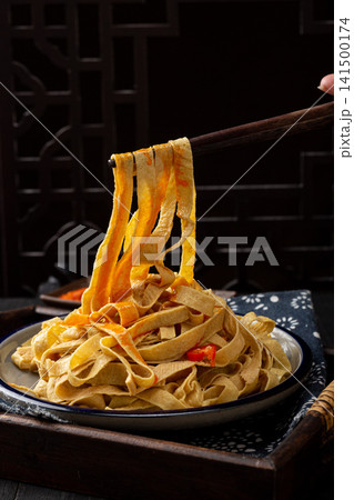 shredded tofu skin salad mixed with colorful bell peppers 141500174