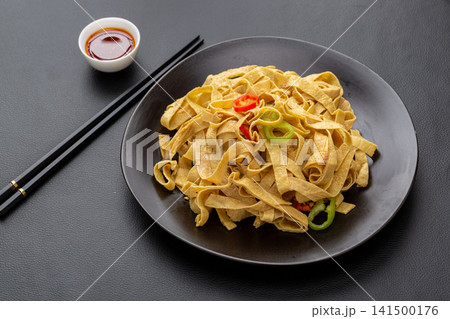 shredded tofu skin salad mixed with colorful bell peppers 141500176