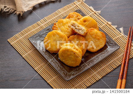 deep fried lotus root slices stuffed with savory meat filling 141500184