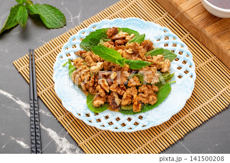 fresh walnut kernel salad mixed with aromatic mint leaves fresh walnut kernel salad mixed with aromatic mint leaves 141500208