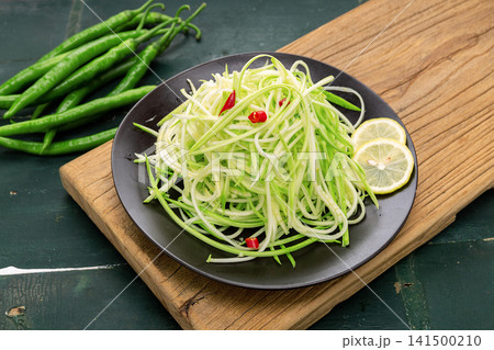 chilled shredded bottle gourd salad finely sliced with light oil chilled shredded bottle gourd salad finely sliced with light oil 141500210