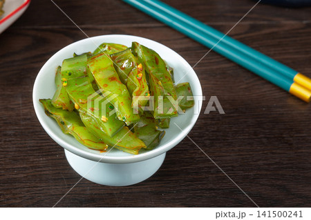 spicy undaria seaweed salad cut stems seasoned with chili oil 141500241