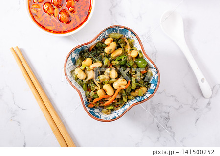 salted potherb mustard greens mixed with soybeans and carrot strips 141500252