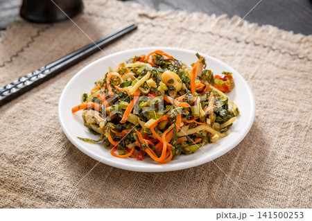 salted potherb mustard greens mixed with soybeans and carrot strips salted potherb mustard greens mixed with soybeans and carrot strips 141500253