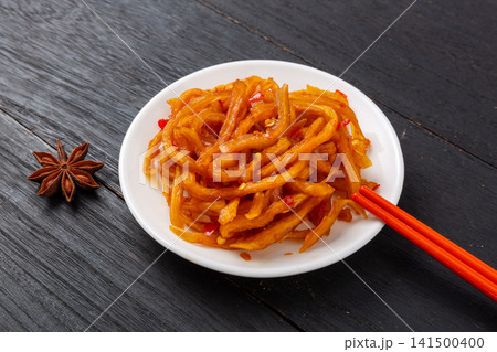 spicy pickled papaya strips seasoned with red chili sauce strands spicy pickled papaya strips seasoned with red chili sauce strands 141500400