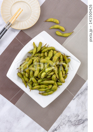 spiced boiled green edamame pods cooked with five spice spiced boiled green edamame pods cooked with five spice 141500426