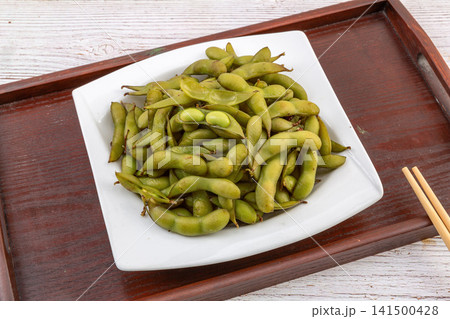 spiced boiled green edamame pods cooked with five spice spiced boiled green edamame pods cooked with five spice 141500428