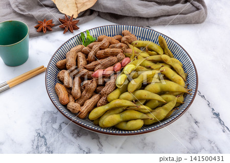 spiced boiled edamame pods and peanuts in shell assortment spiced boiled edamame pods and peanuts in shell assortment 141500431