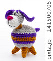 Knitted woolen dog on a white background 141500705