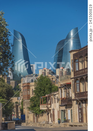 Baku old town street with carved balconies against Flame Towers with copy space Baku old town street with carved balconies against Flame Towers with copy space 141500819