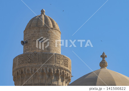 Mosque minaret and dome of Shirvanshah palace in Baku with blue sky and copy space 141500822
