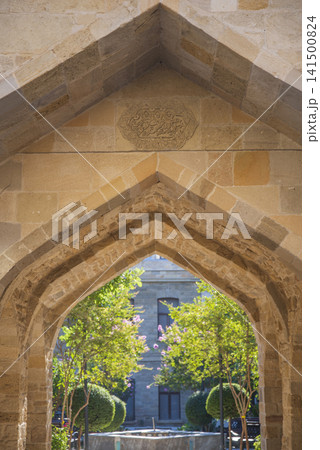 Vertical stone arch in old Baku with carved medallion and copy space Vertical stone arch in old Baku with carved medallion and copy space 141500824