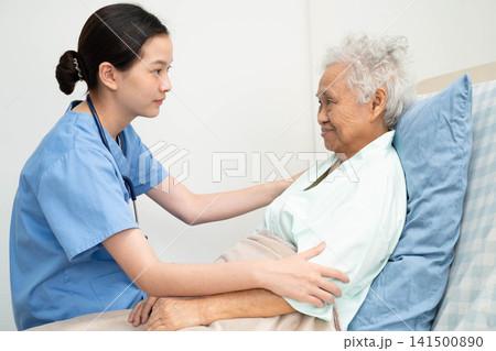 Asian doctor checking and treat elderly woman patient health in hospital. Asian doctor checking and treat elderly woman patient health in hospital. 141500890