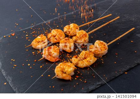grilled Shrimp Skewers Seasoned with Barbecue Spices and Herbs 141501094