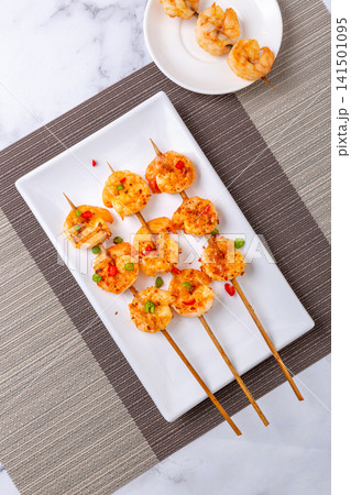 grilled Shrimp Skewers Seasoned with Barbecue Spices and Herbs 141501095